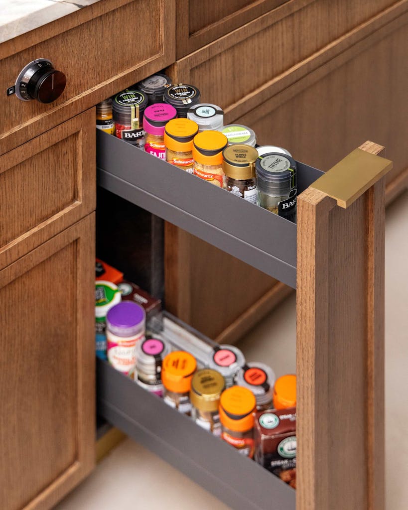 Bespoke modern kitchen in Esher with fluted oak cabinetry and leathered stone island by HUX London